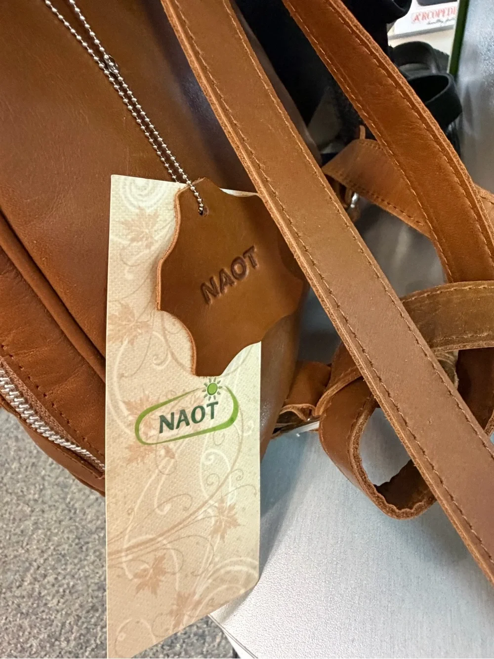 NAOT women’s Tan and Metallic Gold Leather Backpack